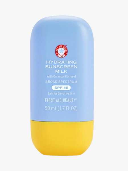 Baby blue container of First Aid Beauty Hydrating Sunscreen Milk with bright yellow cap on light gray background